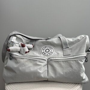 Kipling Light Gray Duffel Bag with Striped Strap